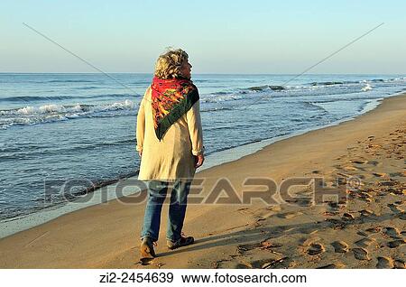 A woman on the beach. Ebro Delta Natural Park. Tarragona, Spain View Large Photo Image Stock Photo - A woman on the beach. Ebro Delta Natural Park. Tarragona, Spain. Fotosearch