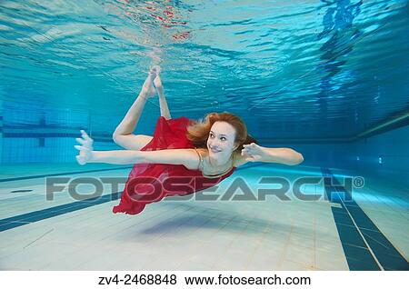 A young woman under water in a swimming bath. View Large Photo Image Stock Photo - A young woman under water in a swimming bath.. Fotosearch