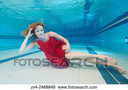 A young woman under water in a swimming bath. View Large Photo Image Stock Photo - A young woman under water in a swimming bath.. Fotosearch
