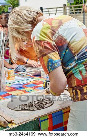 Amateur artists while modeling clay to obtain raku ceramics. View Large Photo Image Stock Photo - Amateur artists while modeling clay to obtain raku ceramics.. Fotosearch