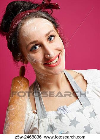 Close up, funny housewife and kitchen utensil, pink background. View Large Photo Image Stock Photograph - Close up, funny housewife and kitchen utensil, pink background.. Fotosearch