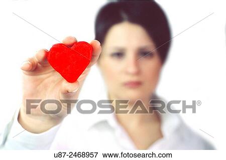 Close-up of a woman holding heart.. View Large Photo Image Stock Photo - Close-up of a woman holding heart... Fotosearch