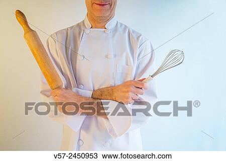 Cook crossing arms with a rolling pin and abeater, posing as an Egyptian pharaoh. View Large Photo Image Stock Image - Cook crossing arms with a rolling pin and abeater, posing as an Egyptian pharaoh.. Fotosearch