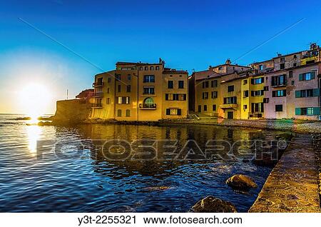 Europe, France, Var, Saint-Tropez. Colored houses in the Ponche beach in the early morning. View Large Photo Image Stock Image - Europe, France, Var, Saint-Tropez. Colored houses in the Ponche beach in the early morning.. Fotosearch