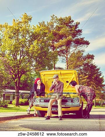 Friends together and old Dodge - 70's theme, intentional film grain added. View Large Photo Image Stock Image - Friends together and old Dodge - 70's theme, intentional film grain added.. Fotosearch