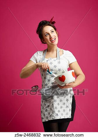 Funny housewife and kitchen utensils, pink background. View Large Photo Image Stock Image - Funny housewife and kitchen utensils, pink background.. Fotosearch