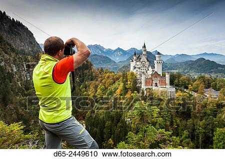 Germany, Bavaria, Hohenschwangau, Schloss Neuschwanstein castle and photographer, elevated view, R. View Large Photo Image Stock Image - Germany, Bavaria, Hohenschwangau, Schloss Neuschwanstein castle and photographer, elevated view, R.. Fotosearch
