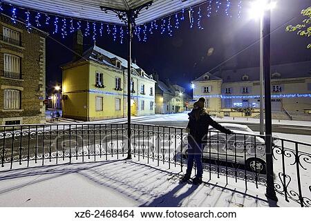 Girl at night in a bandstand at Christmas with snow, Louhans, Saône-et-Loire, Bourgogne, France, Europe. View Large Photo Image Picture - Girl at night in a bandstand at Christmas with snow, Louhans, Saône-et-Loire, Bourgogne, France, Europe.. Fotosearch