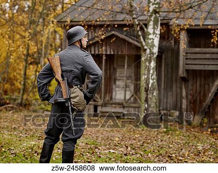Stock Photo - Historic costume theme World War II, Finnish soldier and Submachine-gun Finland m/31 SJR (muzzle brake version). Photographed in the Ragvalds museum area in Kirkkonummi, Finland.. Fotosearch