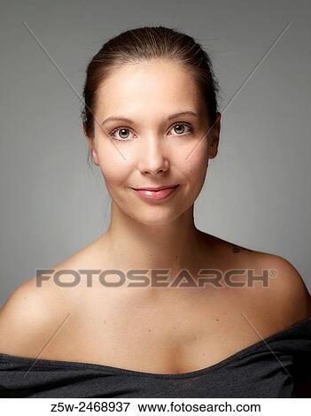 Stock Photo - Portrait, natural beautiful woman face, head and shoulder shot.. Fotosearch
