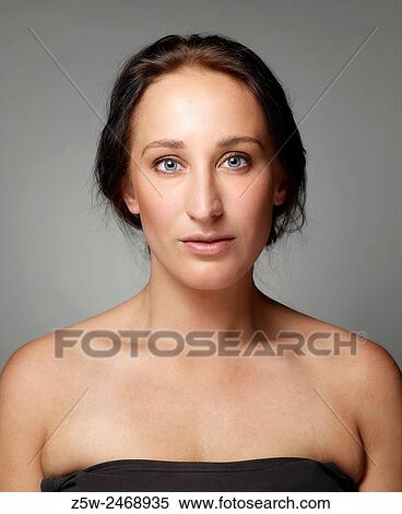 Stock Photography - Portrait, natural beautiful woman face, head and shoulder shot.. Fotosearch