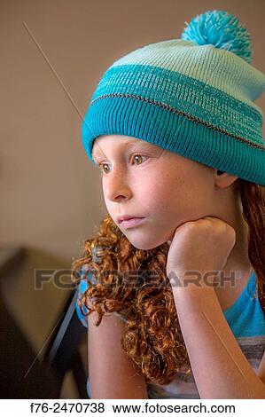 Stock Photo - Portrait of serious 10 year old girl with woolen cap on, in Berkeley, CA, MR# 6063. Fotosearch