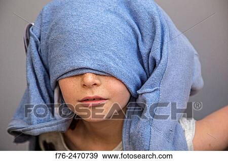 Portrait of serious 10 year old girl playing with shirt wrapped around her head, in Berkeley, CA, MR# 6063 View Large Photo Image Stock Photo - Portrait of serious 10 year old girl playing with shirt wrapped around her head, in Berkeley, CA, MR# 6063. Fotosearch