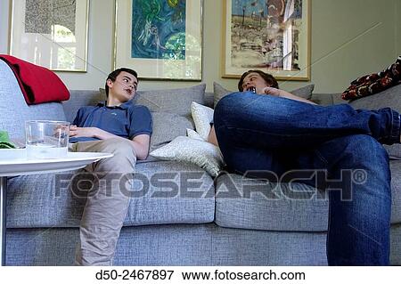 STOCKHOLM, SWEDEN Teenagers on couch. View Large Photo Image Stock Photo - STOCKHOLM, SWEDEN Teenagers on couch.. Fotosearch