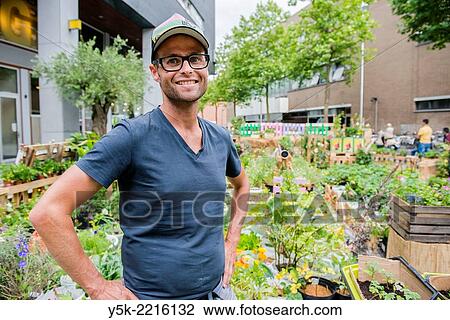 Tilburg, Netherlands. Bram is an Urban Gardener, maintaining his urban kitchen garden down town Tilburg. View Large Photo Image Stock Image - Tilburg, Netherlands. Bram is an Urban Gardener, maintaining his urban kitchen garden down town Tilburg.. Fotosearch