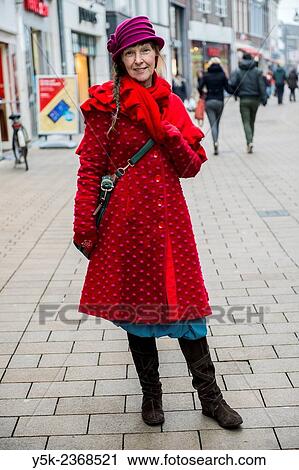 Tilburg, Netherlands. Street portrait of a 61 year old colorful dressed and fashionable woman. View Large Photo Image Stock Image - Tilburg, Netherlands. Street portrait of a 61 year old colorful dressed and fashionable woman.. Fotosearch