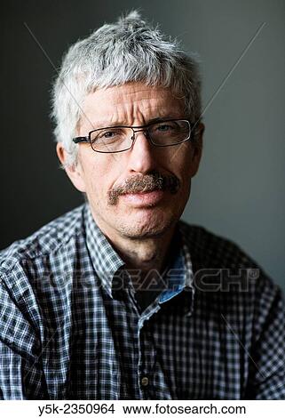 Tilburg, Netherlands. Studio portrait of a middle aged man wearing glasses and mustache. View Large Photo Image Picture - Tilburg, Netherlands. Studio portrait of a middle aged man wearing glasses and mustache.. Fotosearch