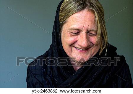 Tilburg, Netherlands. Studio portrait of a middle aged woman laughing. View Large Photo Image Stock Image - Tilburg, Netherlands. Studio portrait of a middle aged woman laughing.. Fotosearch