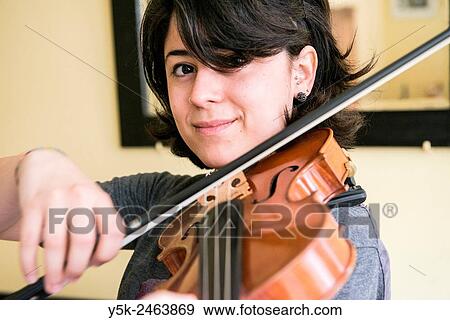 Tilburg, Netherlands. Young Italian violinist practising and rehearsing, in preparation of her conservatoire exam. View Large Photo Image Stock Photo - Tilburg, Netherlands. Young Italian violinist practising and rehearsing, in preparation of her conservatoire exam.. Fotosearch