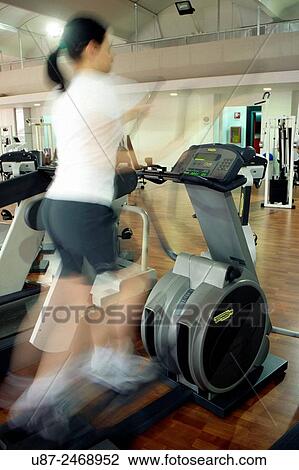 Woman exercising on treadmill.. View Large Photo Image Stock Image - Woman exercising on treadmill... Fotosearch