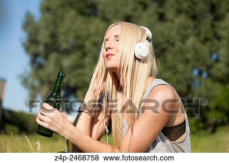 Woman singing with a song. View Large Photo Image Stock Photo - Woman singing with a song.. Fotosearch