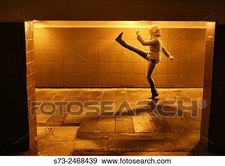 Stock Photo - Woman walking in Moscow underground, Moscow, Russia. Fotosearch