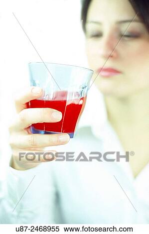Young woman holding fruit juice. View Large Photo Image Stock Photography - Young woman holding fruit juice.. Fotosearch