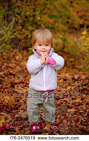 1 year old girl playing with autumn leaves.. View Large Photo Image Stock Photo - 1 year old girl playing with autumn leaves... Fotosearch