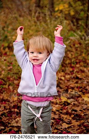 1 year old girl playingin autumn leaves. View Large Photo Image Stock Image - 1 year old girl playingin autumn leaves.. Fotosearch