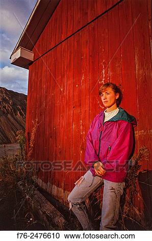 24 year old woman in torn bluejeans, leaning against the side of a red barn in Vermont, model released, mr_2715. View Large Photo Image Stock Image - 24 year old woman in torn bluejeans, leaning against the side of a red barn in Vermont, model released, mr_2715.. Fotosearch