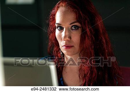 37 year old redheaded woman looking at the camera over a computer screen. View Large Photo Image Stock Image - 37 year old redheaded woman looking at the camera over a computer screen.. Fotosearch