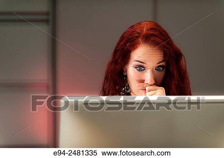 37 year old redheaded woman which had over her mouth and looking down at a computer screen. View Large Photo Image Stock Photography - 37 year old redheaded woman which had over her mouth and looking down at a computer screen.. Fotosearch