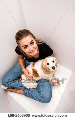 a 19 year old woman with her cocker spaniel in a white box. View Large Photo Image Stock Photograph - a 19 year old woman with her cocker spaniel in a white box.. Fotosearch