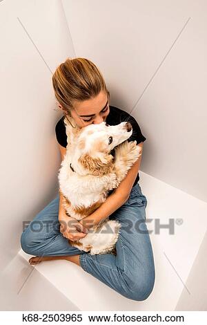 a 19 year old woman with her cocker spaniel in a white box. View Large Photo Image Stock Photography - a 19 year old woman with her cocker spaniel in a white box.. Fotosearch