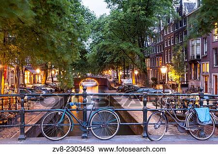 A canal in Amsterdam, Netherlands. The canals of central Amsterdam have been designated a World Heritage Siye by UNESCO. View Large Photo Image Stock Image - A canal in Amsterdam, Netherlands. The canals of central Amsterdam have been designated a World Heritage Siye by UNESCO.. Fotosearch