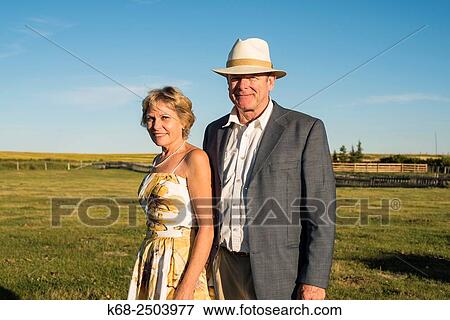 a couple in their sixties at a wedding on a farm in southern Alberta. View Large Photo Image Stock Photo - a couple in their sixties at a wedding on a farm in southern Alberta.. Fotosearch