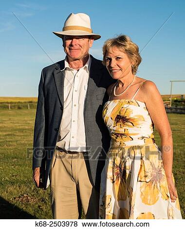 a couple in their sixties at a wedding on a farm in southern Alberta. View Large Photo Image Stock Photo - a couple in their sixties at a wedding on a farm in southern Alberta.. Fotosearch