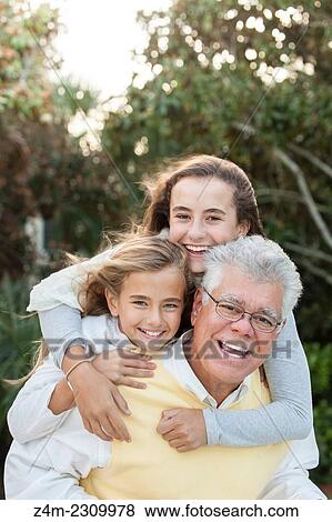 A father and his two tween daughters laugh and smile for the camera. Coastal Georgia, USA View Large Photo Image Stock Photo - A father and his two tween daughters laugh and smile for the camera. Coastal Georgia, USA. Fotosearch