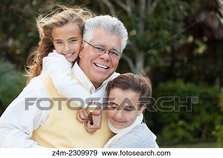 A father enjoys time with his two tween daughters. Coastal Georgia, USA View Large Photo Image Stock Photo - A father enjoys time with his two tween daughters. Coastal Georgia, USA. Fotosearch
