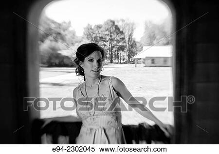 A portrait of a 36 year old brunette woman outdoors looking directly at the camera, black & white. View Large Photo Image Stock Photography - A portrait of a 36 year old brunette woman outdoors looking directly at the camera, black & white.. Fotosearch