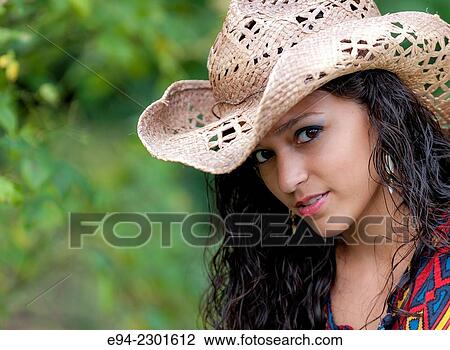 A smiling 19 year old brunette woman wearing a straw hat looking at the camera. View Large Photo Image Stock Image - A smiling 19 year old brunette woman wearing a straw hat looking at the camera.. Fotosearch