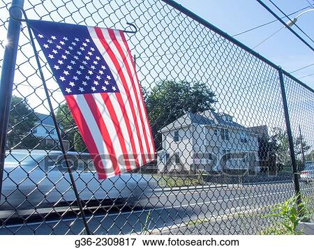 American flag on chainlink fence at the Manton Bend Community Garden in Providence, Rhode Island. View Large Photo Image Stock Photo - American flag on chainlink fence at the Manton Bend Community Garden in Providence, Rhode Island.. Fotosearch