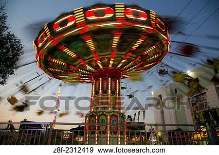 Stock Photo - Amusement Ride at Dusk, Los Angeles County Fair, Fairplex, California, USA.. Fotosearch