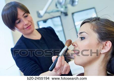 Applying make up. Hairdressing salon and Beauty Clinic. View Large Photo Image Picture - Applying make up. Hairdressing salon and Beauty Clinic.. Fotosearch