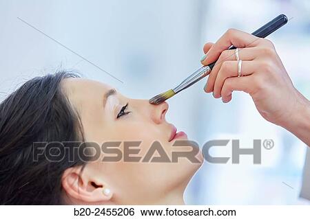 Applying make up. Hairdressing salon and Beauty Clinic. View Large Photo Image Stock Photograph - Applying make up. Hairdressing salon and Beauty Clinic.. Fotosearch