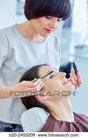 Applying mascara. Hairdressing salon and Beauty Clinic. View Large Photo Image Stock Photo - Applying mascara. Hairdressing salon and Beauty Clinic.. Fotosearch