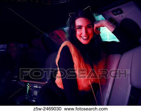 Attractive brunette girl posing inside the limousine. View Large Photo Image Stock Image - Attractive brunette girl posing inside the limousine.. Fotosearch