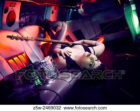 Attractive girl posing inside the limousine, electric bass. View Large Photo Image Stock Image - Attractive girl posing inside the limousine, electric bass.. Fotosearch