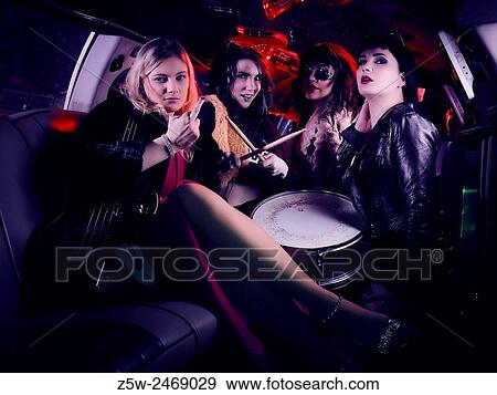 Attractive girls partying together, inside the limousine, music instruments. View Large Photo Image Stock Photo - Attractive girls partying together, inside the limousine, music instruments.. Fotosearch