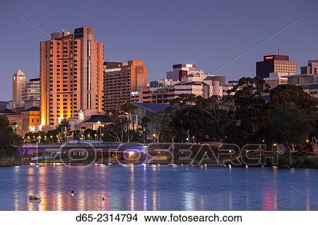 Picture - Australia, South Australia, Adelaide, skyline from Torrens Lake, daytime, dusk.. Fotosearch